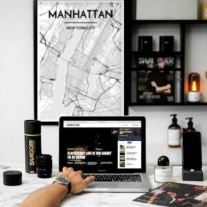 Chic workspace featuring a MacBook, stylish decor, and Manhattan map art.